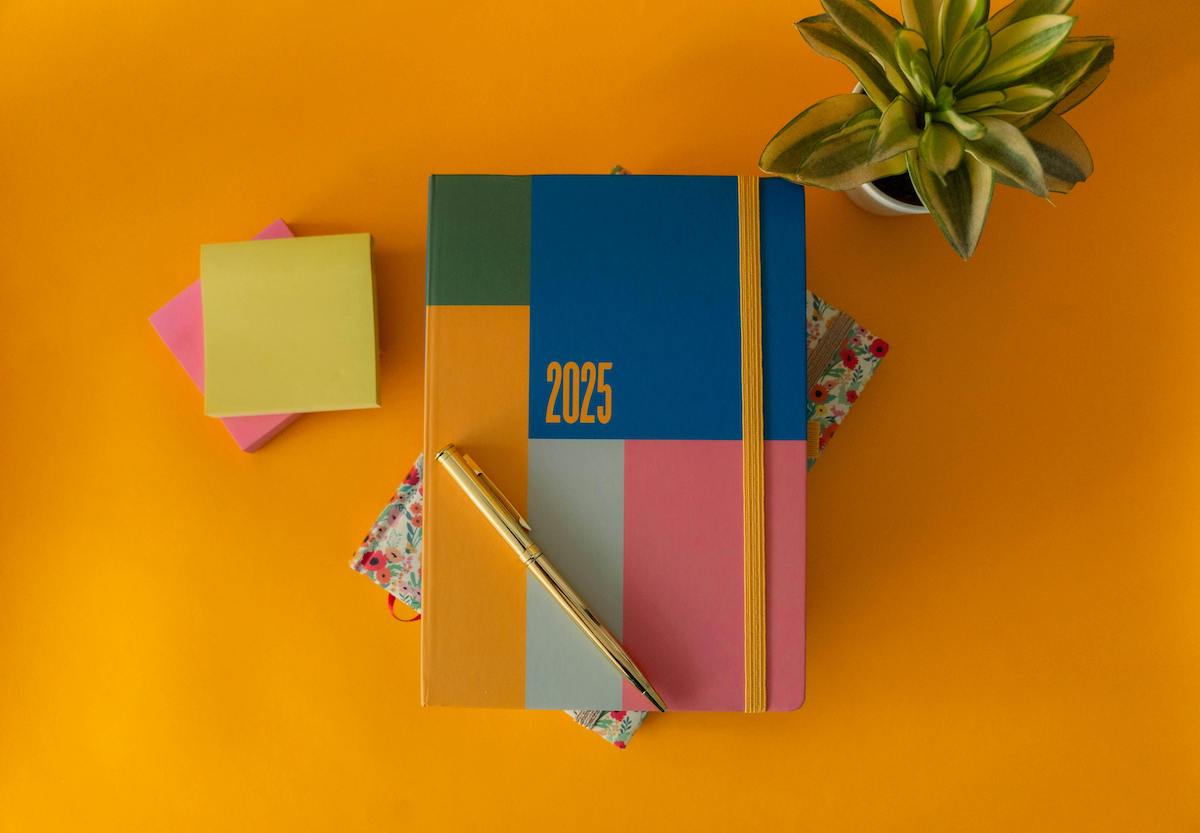 2025 new year planner symbolizing new year business goals