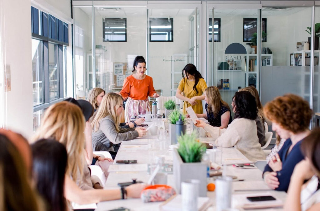 An image of a group of women entrepreneurs gathering for a peer support group.