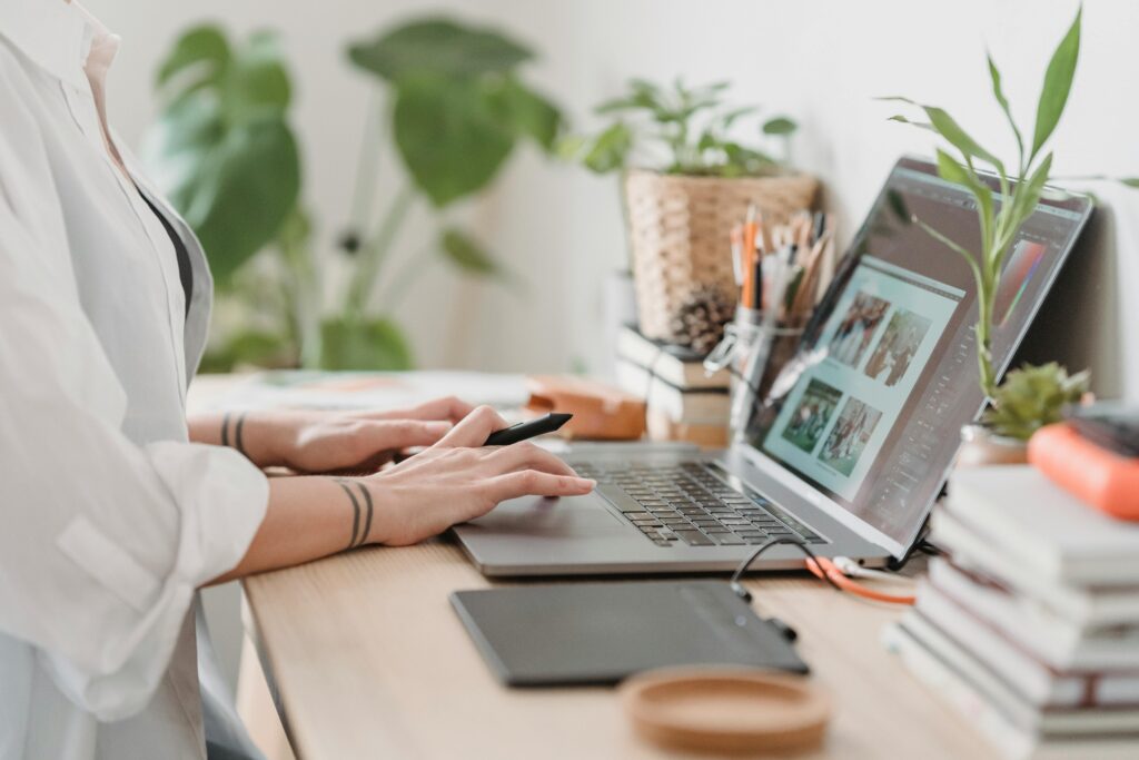 An image of a woman using her laptop to help build her business.