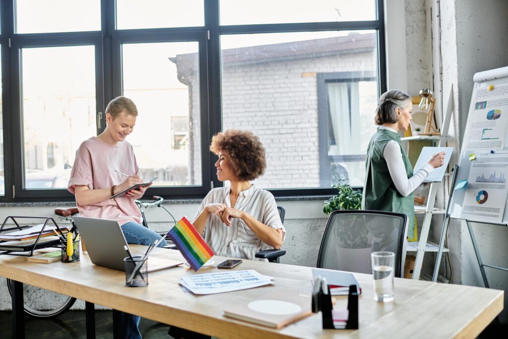 Women collaborating in a bright office space, sharing ideas and working on projects together