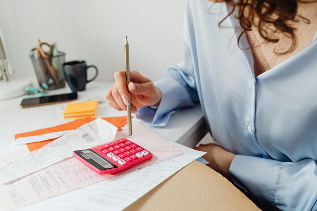 A woman working on her invoicing for her business.