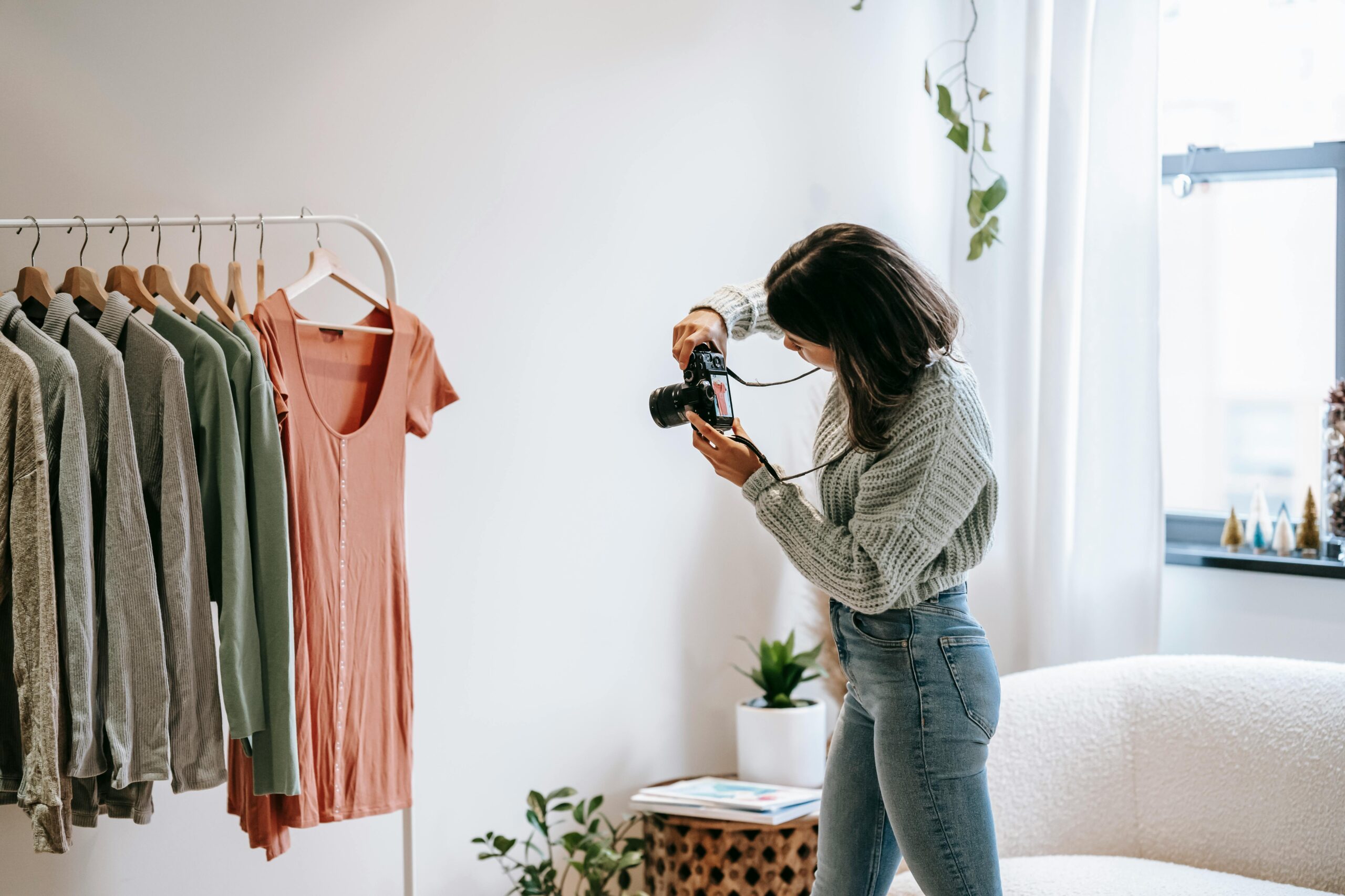 Female small business owner photographing her product to showcase online marketing strategy