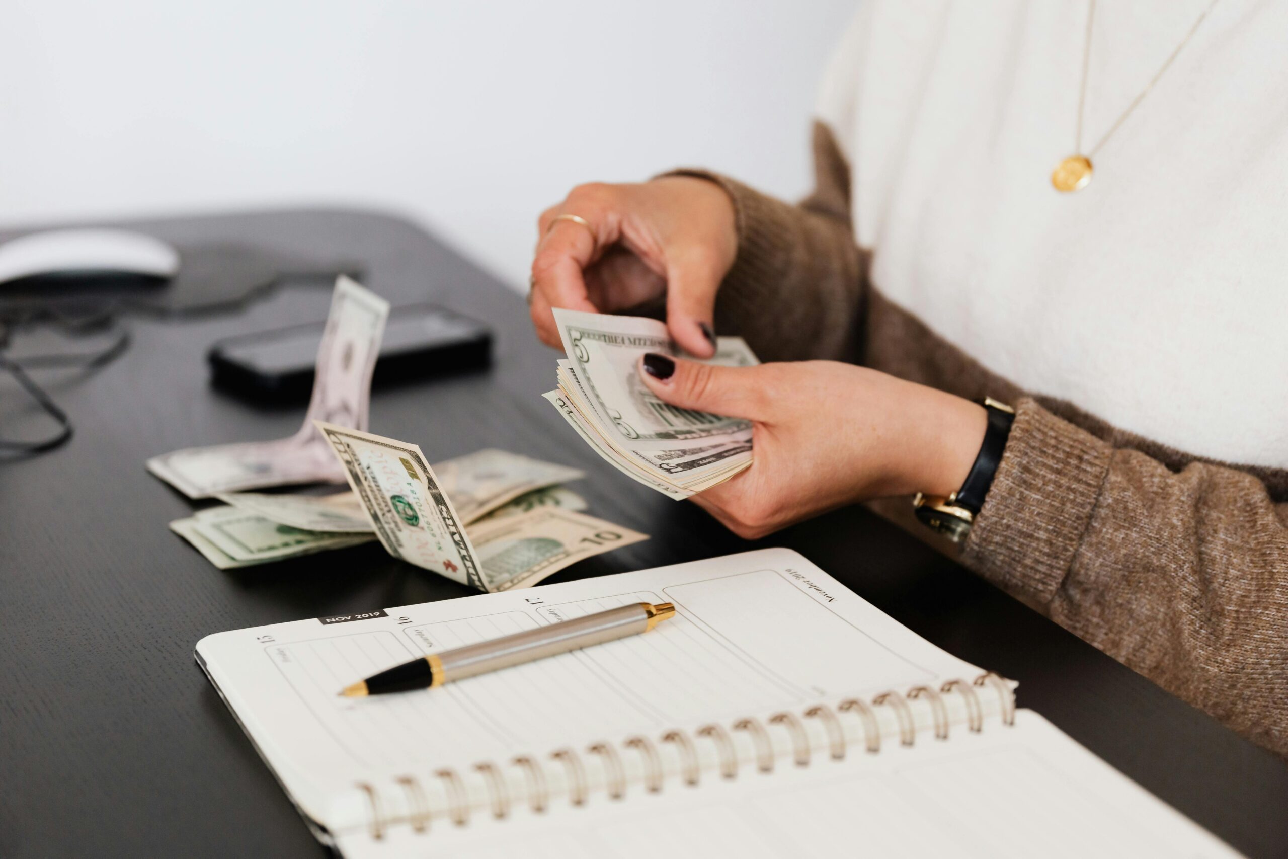 woman counting startup money for business